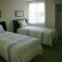 Westbury Apartments bedroom with large window, closet and 2 twin beds